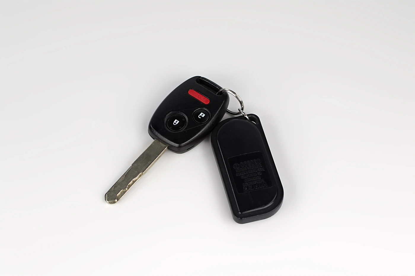 Car key with remote fob on a white background, car key help